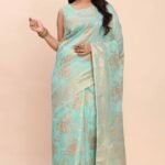 Turquoise Linen Cotton Saree Showcasing Floral Zari Weaves & A Tasselled Finish Pallu